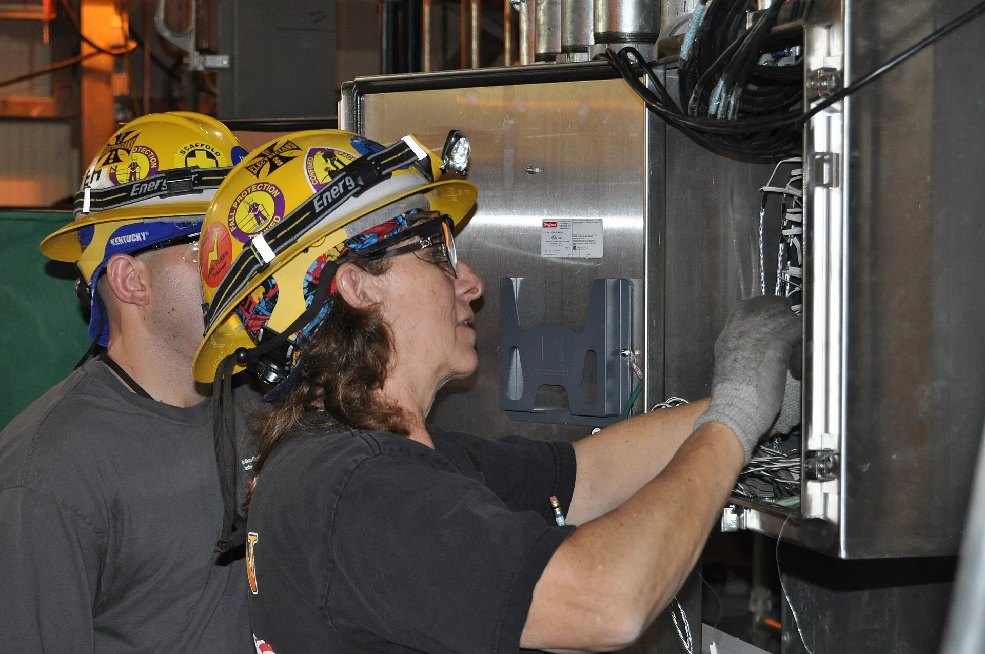 Blue Grass Chemical Agent-Destruction Pilot Plant electricians install wiring in an electrical panel box inside the Control and Support Building, the nerve center of future plant operations. Electrical contractor business plan, section by section