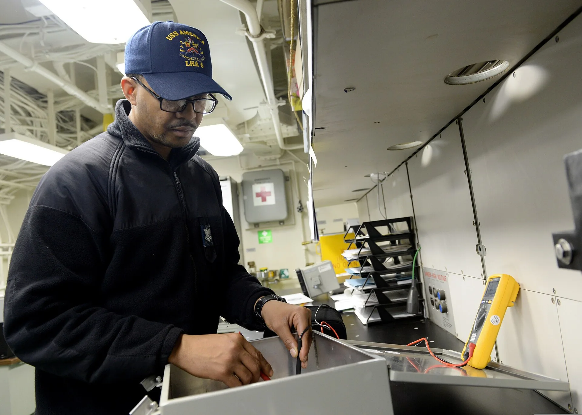 U.S. Navy Interior Communications Electrician 2nd Class Allen Trent, assigned to the amphibious assault ship USS America (LHA 6), uses a multimeter to test continuity on a telephone connection box in the interior communications repair shop aboard the ship in the Pacific Ocean Sept. 7, 2014. The newl. Reviewing electrical contractor equipment: strengths, gaps and a verdict