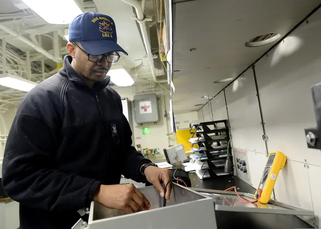 U.S. Navy Interior Communications Electrician 2nd Class Allen Trent, assigned to the amphibious assault ship USS America (LHA 6), uses a multimeter to test continuity on a telephone connection box in the interior communications repair shop aboard the ship in the Pacific Ocean Sept. 7, 2014. The newl. Reviewing electrical contractor equipment: strengths, gaps and a verdict