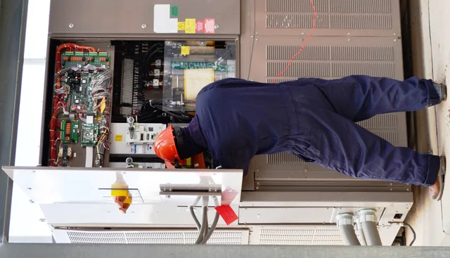 A Pueblo Chemical Agent-Destruction Pilot Plant master electrician checks the Chiller Water System control panel for zero energy before working on equipment. Arc-flash rated clothing, such as the one worn in this photo, is necessary when working with high voltage electrical systems. Staffing an electrical contractor business properly for 2027