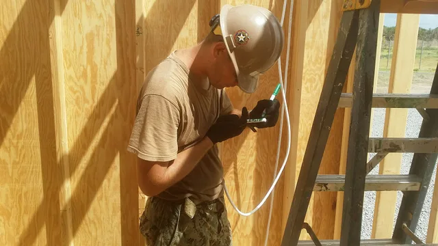 160620-N-ZZ999-002 MANDA BAY, Kenya (June 20, 2016) Construction Electrician 3rd Class Kirtis Waters, assigned to Naval Mobile Construction Battalion 133 Detail Horn of Africa, marks electrical wiring for future hook up to an electrical panel in a Southwest Asia Hut, at Manda Bay, Kenya, June 20, 20. Electrical contractor pricing that protects profit