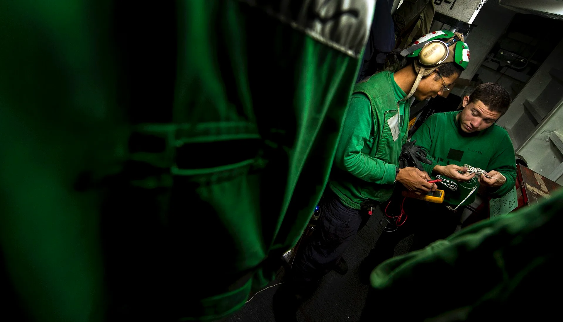 ARABIAN SEA (Feb. 3, 2011) Aviation Electrician's Mate 1st Class Gregory Gates and Aviation Electrician's Mate 2nd Class Brian Smith, both assigned to Strike Fighter Squadron (VFA) 25, run electrical tests on aircraft equipment inside the squadron electrical shop aboard the Nimitz-class aircraft car. Second-hand or new electrical contractor business equipment: a cost decision