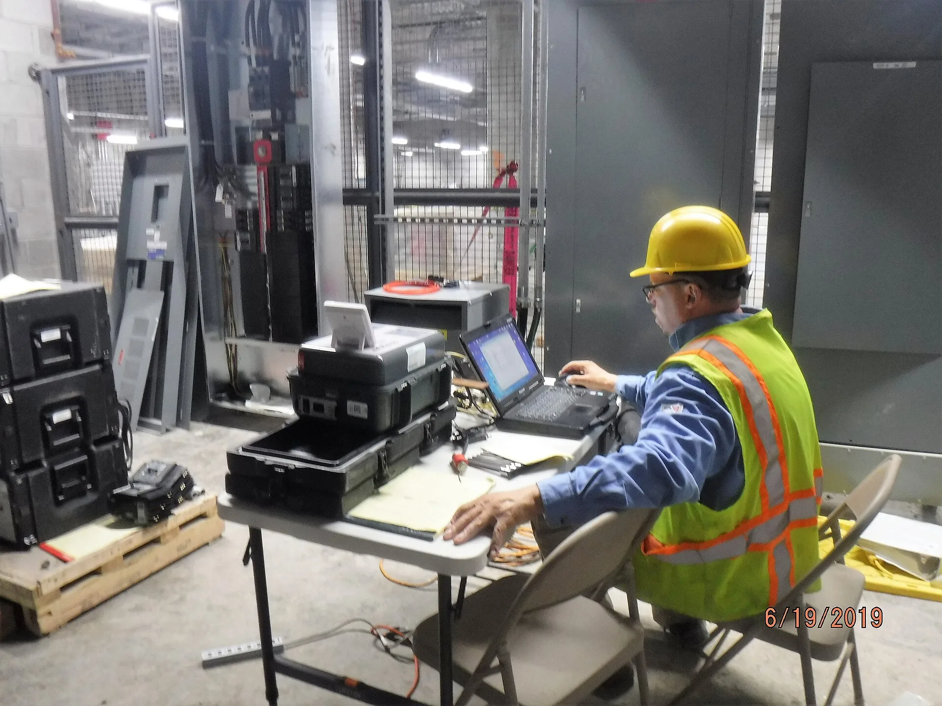 Performing injection testing on the electrical breakers after a panel upgrade in a power substation. 06-19-19. Panel Upgrade EV Charger Toronto: Contractor Scope